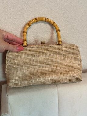 Tommy Bahama Beige Woven
Clutch with Bamboo Handle